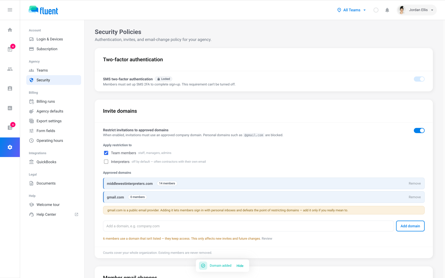 Invite domains card with the restriction on, 2 approved domains, and the public email provider warning